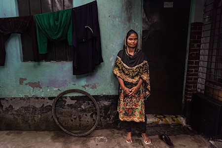 Mosammad Bulbuli in front of her house